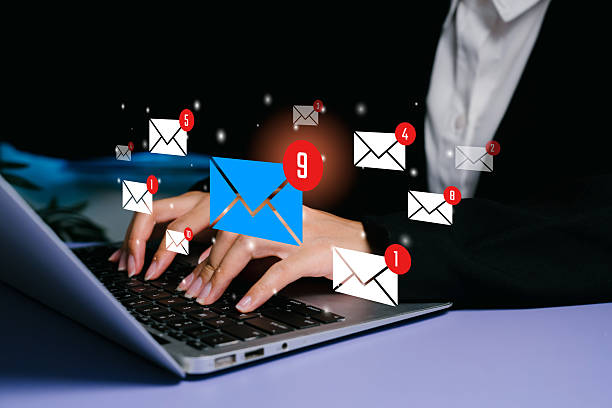 istock Email overload concept. Hands typing on laptop with floating message icons and notification badges, communication pressure, task overflow, digital workflow management challenges. 2250144351