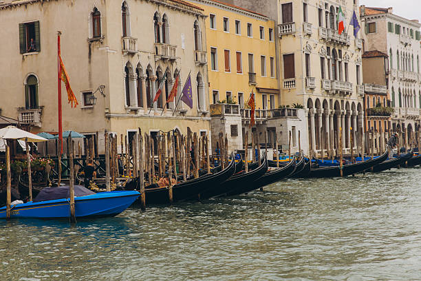 Venice, Italy - October 9, 2025: Canal Grande in Venice showing moored gondolas and historic buildings with Venetian architecture, reflecting travel and tourism
