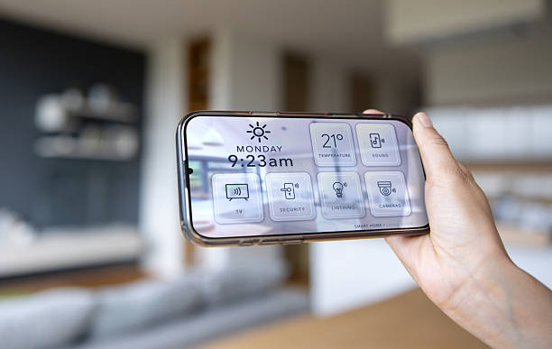 istock Woman using a mobile app on her cell phone to control her smart home 2250145070