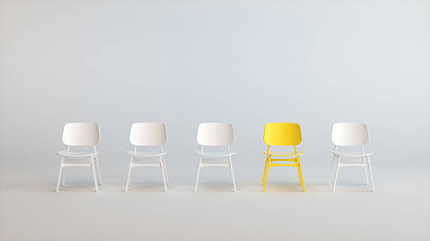 istock Minimal 3D Row of Chairs with Single Yellow Standout Seat in White Studio 2250146072