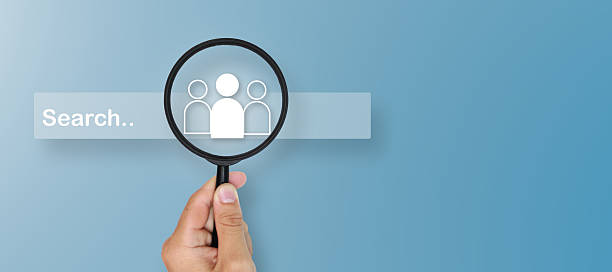 istock Business concept: Human Resources (HR) with a magnifying glass icon highlighting group icons within the search bar, representing recruitment, candidate selection, talent search, and employee. 2250148170