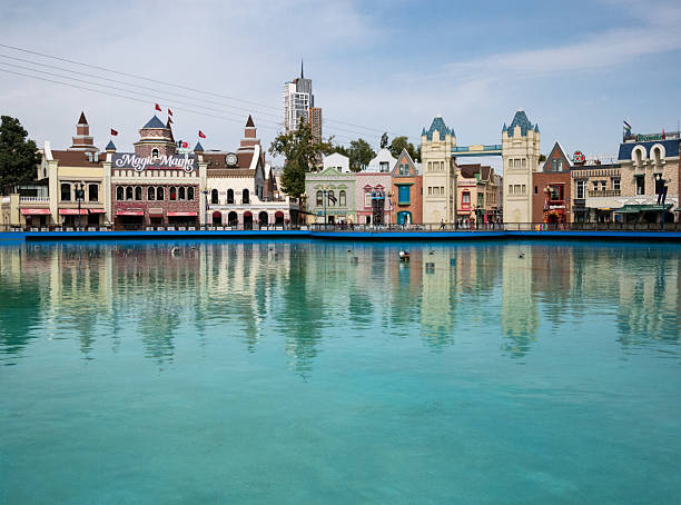 Tashkent, Uzbekistan - September 15, 2025: View of central entrance to the amusement park Magic City with restaurants and shops at sunny day