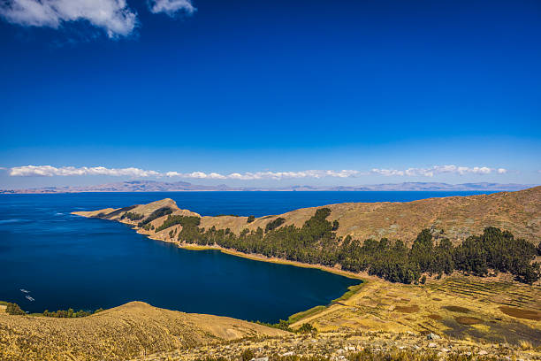 View from Isla del Sol (Island Of The Sun), Lake Titicaca, Bolivia. Isla del Sol is an island in the southern part of Lake Titicaca. It is part of the modern Plurinational State of Bolivia. Titicaca is a highest navigable lake in the Andes on the border of Bolivia and Peru. Lake Titicaca  it is also the largest lake in South America.