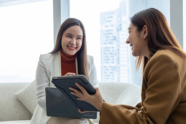 Businesswomen discussing strategy in modern office