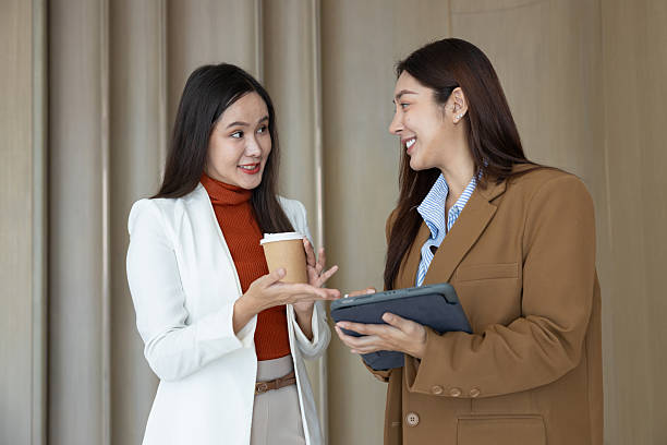 istock Smiling businesswomen chatting during coffee break 2250159001