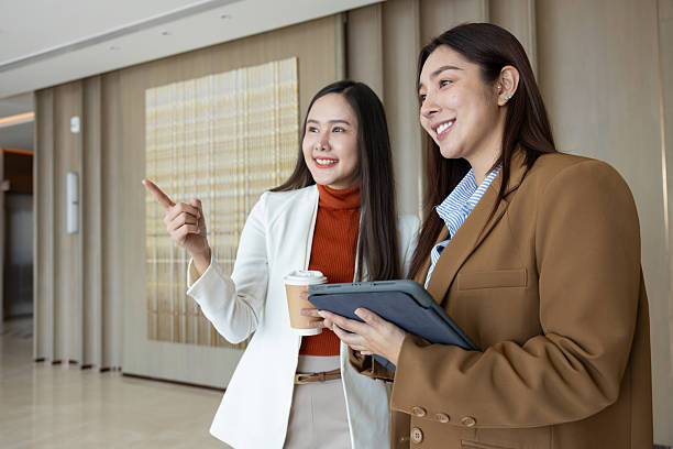 istock Smiling businesswomen chatting during coffee break 2250159031