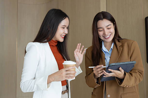 istock Smiling businesswomen chatting during coffee break 2250159049