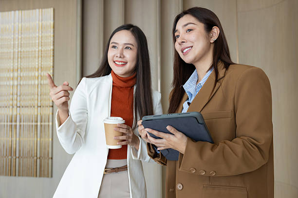 istock Smiling businesswomen chatting during coffee break 2250159070