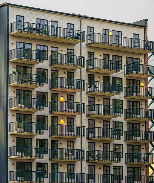 istock apartment building exterior with repeating balconies at dusk. 2250159148