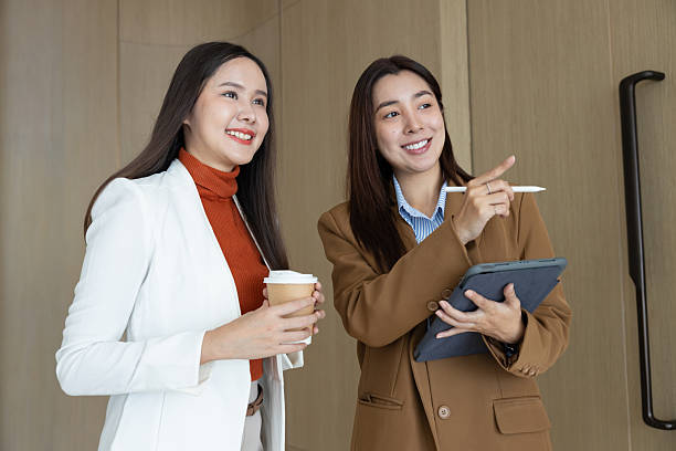 istock Smiling businesswomen chatting during coffee break 2250159236