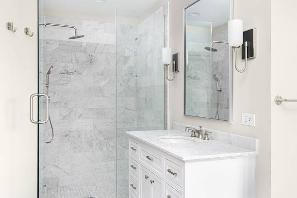 istock A beautiful bathroom with a white cabinet and marble tiled shower. 2250161036