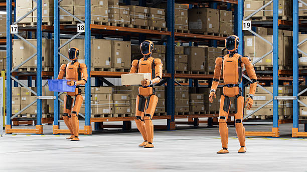 istock 3D Render: Industrial Automation Empowered by Artificial Intelligence. Group of Autonomous AI-Enabled General Purpose Humanoid Robots at Distribution Center. Automated Fulfillment Center or Warehouse 2250162997
