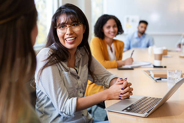 istock Diverse group collaborating in modern office meeting, engaged and smiling. 2250165059