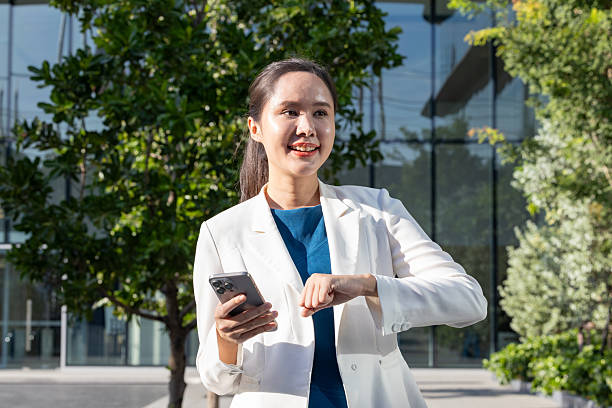 istock Businesswoman using voice command on smartphone 2250165434