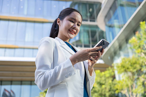 istock Businesswoman using voice command on smartphone 2250165441