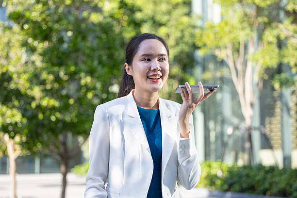 istock Businesswoman using voice command on smartphone 2250165447