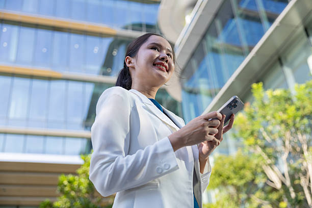 istock Businesswoman using voice command on smartphone 2250165479