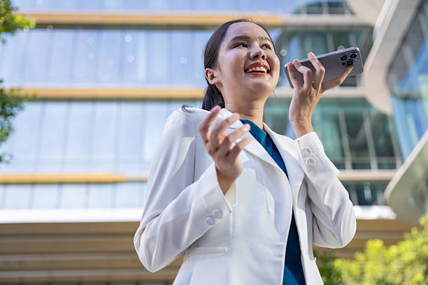 istock Businesswoman using voice command on smartphone 2250165486