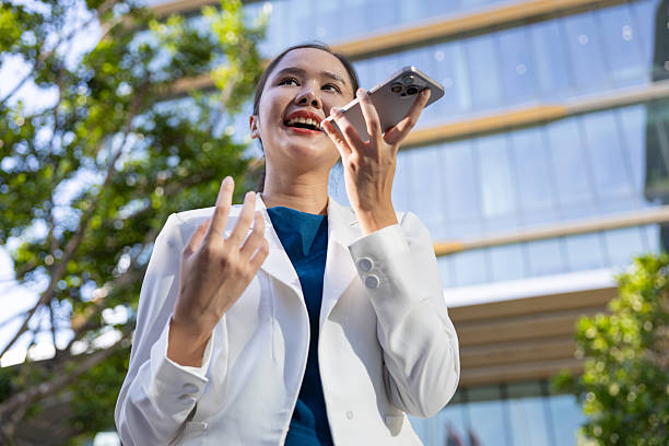 istock Businesswoman using voice command on smartphone 2250165490