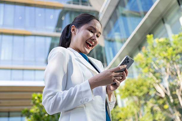 istock Businesswoman using voice command on smartphone 2250165500