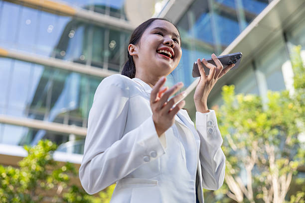 istock Businesswoman using voice command on smartphone 2250165509