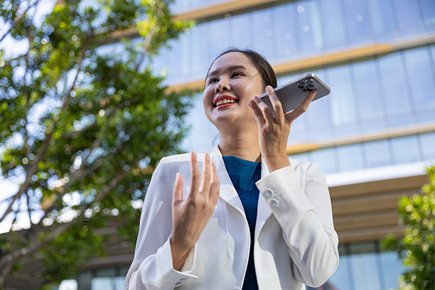 istock Businesswoman using voice command on smartphone 2250165516