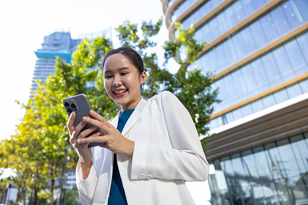 istock Businesswoman using voice command on smartphone 2250165525