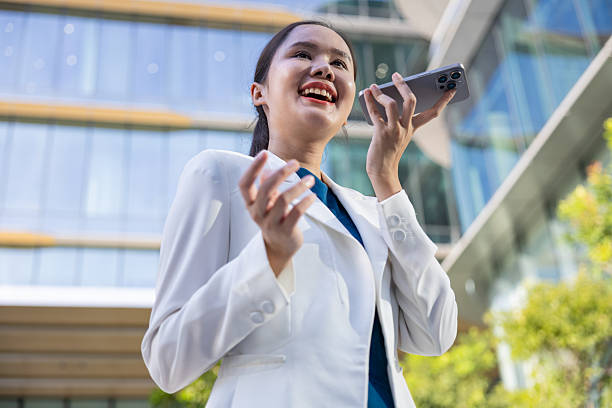 istock Businesswoman using voice command on smartphone 2250165528