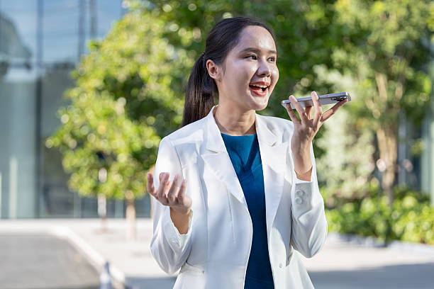 istock Businesswoman using voice command on smartphone 2250165537