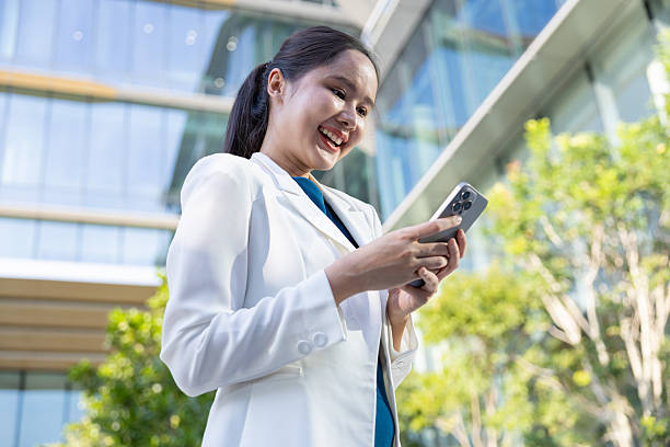 istock Businesswoman using voice command on smartphone 2250165546