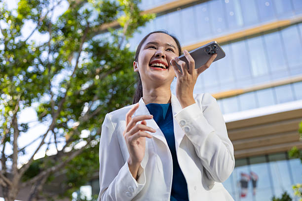 istock Businesswoman using voice command on smartphone 2250165570