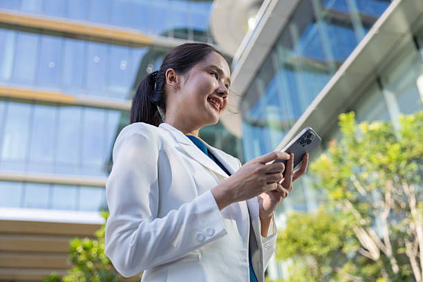 istock Businesswoman using voice command on smartphone 2250165583