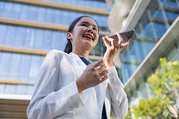 istock Businesswoman using voice command on smartphone 2250165591