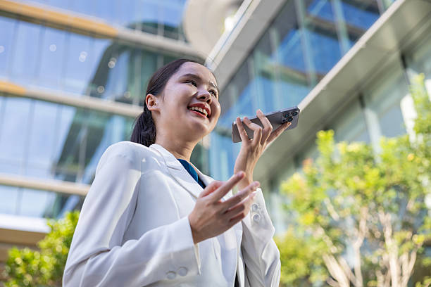 istock Businesswoman using voice command on smartphone 2250165594