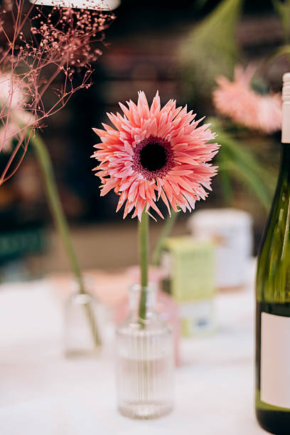 istock Pink Gerbera in Vase on Festive Table, Decorative Floral Arrangement. 2250167994