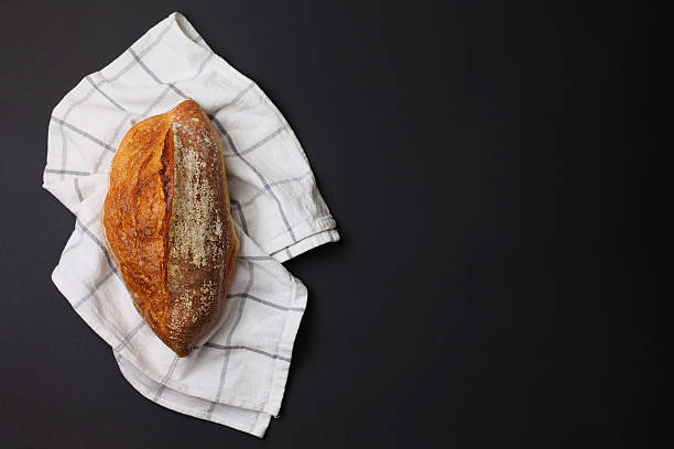 A delightful variety of Fresh Breads, beautifully displayed against a bright background