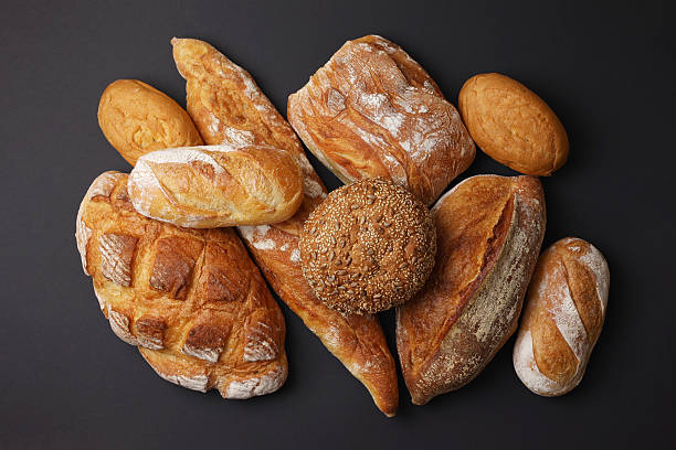 A delightful variety of Fresh Breads, beautifully displayed against a bright background