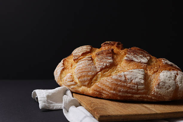 A delightful variety of Fresh Breads, beautifully displayed against a bright background