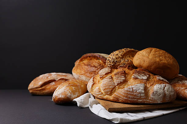 A delightful variety of Fresh Breads, beautifully displayed against a bright background
