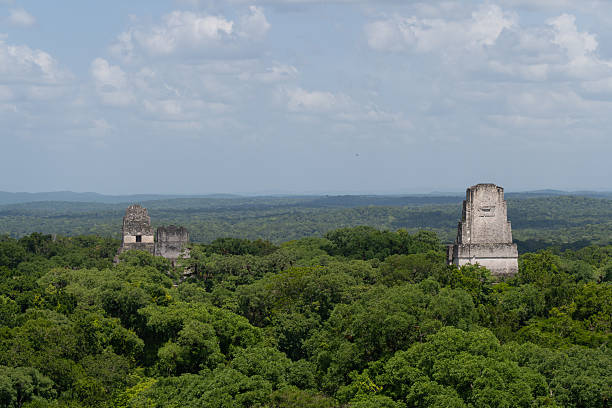 istock Ancient Mayan Tikal Temple Pyramids Rising from Jungle Canopy Guatemala 2250169368