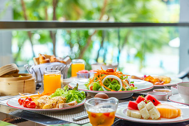 istock Gourmet breakfast buffet with fresh salad, fruit, juice, croissants, 2250170293