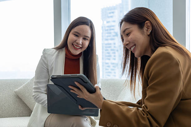 istock Businesswomen discussing strategy in modern office 2250173578