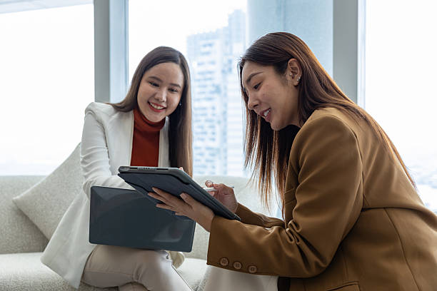 istock Businesswomen discussing strategy in modern office 2250173583