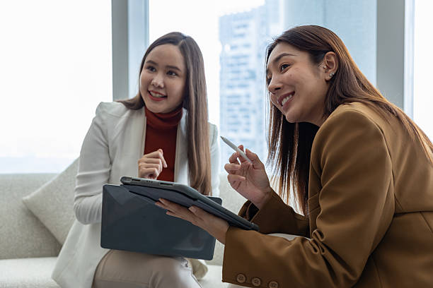 istock Businesswomen discussing strategy in modern office 2250173586