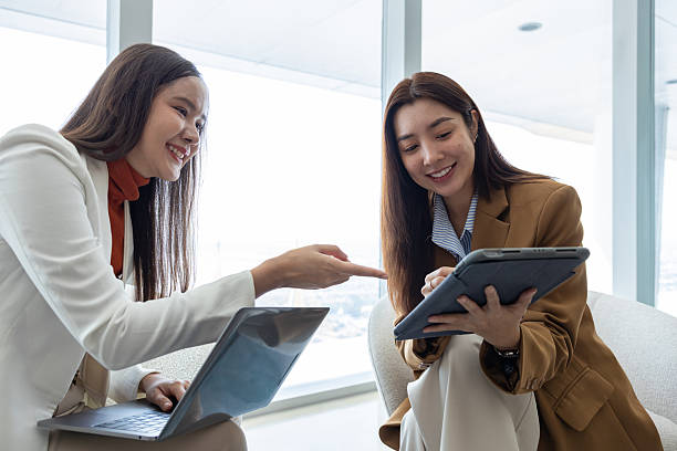istock Businesswomen discussing strategy in modern office 2250173597
