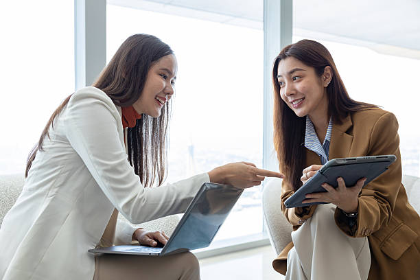 istock Businesswomen discussing strategy in modern office 2250173598