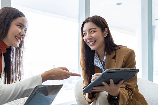 istock Businesswomen discussing strategy in modern office 2250173622