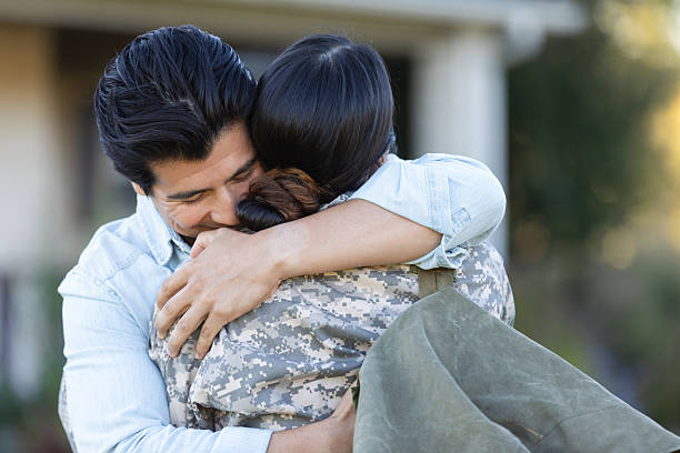 A heartwarming reunion as a soldier is embraced by a loved one.