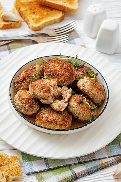 istock frikadellen, Minced Meat Patties in white bowl 2250174775