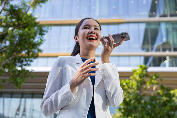 istock Businesswoman using voice command on smartphone 2250174858